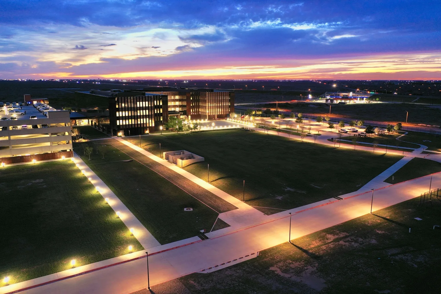 Corporate campus illuminated at sunset
